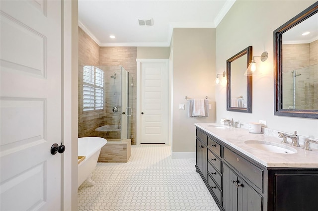 1906 143rd Ct E, Bradenton, FL 34212 - bathroom with a shower stall, a freestanding tub, double vanity, ornamental molding, and recessed lighting