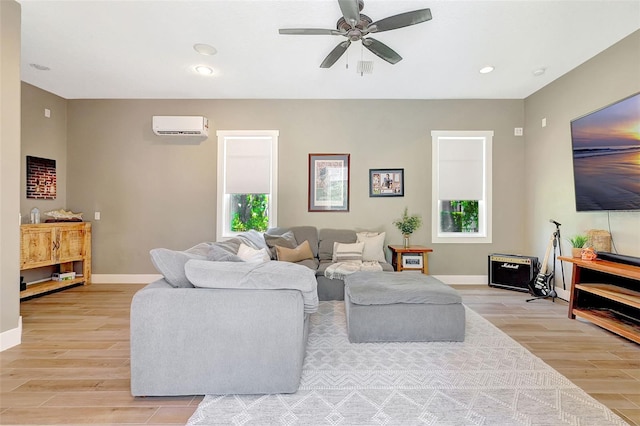 1906 143rd Ct E, Bradenton, FL 34212 - living area with an AC wall unit, light wood-style floors, ceiling fan, and recessed lighting