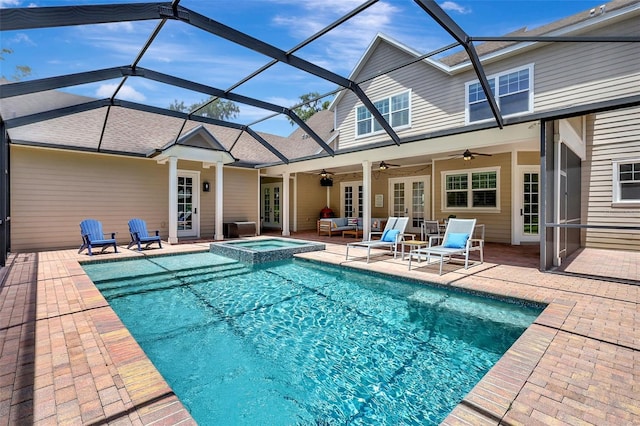 1906 143rd Ct E, Bradenton, FL 34212 - view of swimming pool with a ceiling fan, a patio, glass enclosure, and a pool with connected hot tub