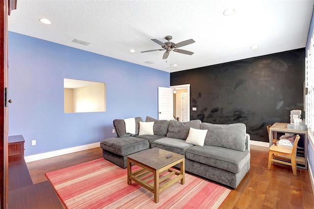 1906 143rd Ct E, Bradenton, FL 34212 - living area with an accent wall, ceiling fan, recessed lighting, and wood finished floors