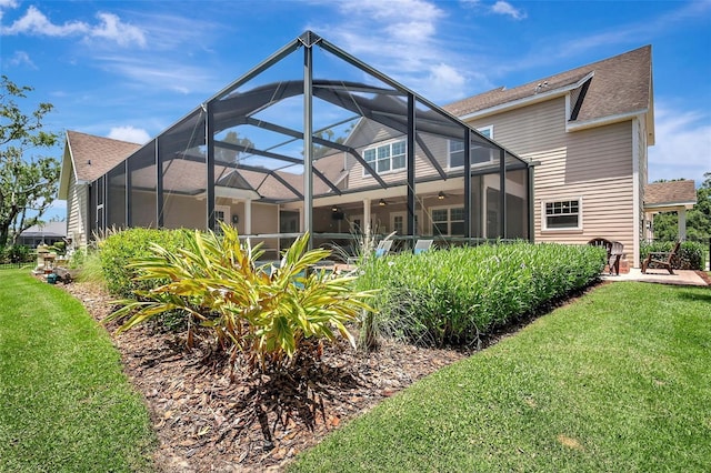 1906 143rd Ct E, Bradenton, FL 34212 - rear view of house with ceiling fan, a yard, a lanai, and roof with shingles