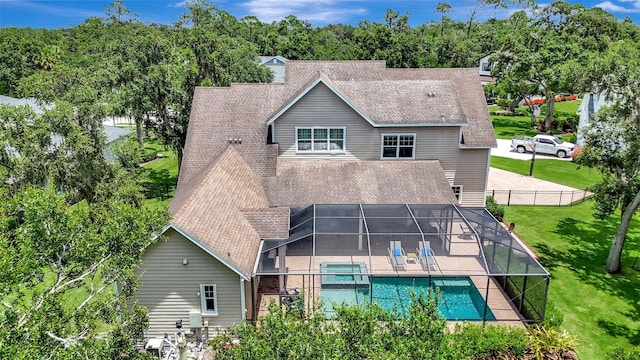 1906 143rd Ct E, Bradenton, FL 34212 - rear view of house with a patio, roof with shingles, a pool with connected hot tub, and glass enclosure