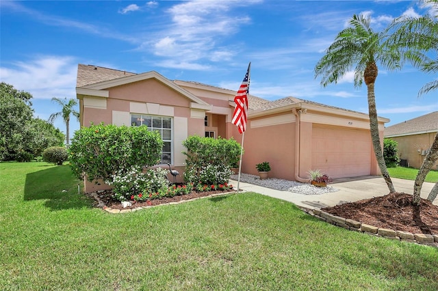 4539 Cabbage Key Ter, Bradenton, FL 34203 - ranch-style home featuring concrete driveway, a garage, stucco siding, and a front yard
