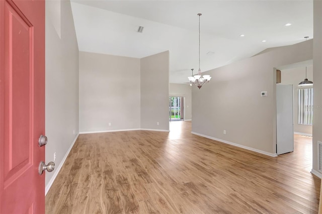 4539 Cabbage Key Ter, Bradenton, FL 34203 - spare room featuring light wood-type flooring, a chandelier, and lofted ceiling