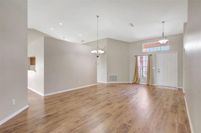 4539 Cabbage Key Ter, Bradenton, FL 34203 - entrance foyer with a chandelier, light wood-style floors, and high vaulted ceiling