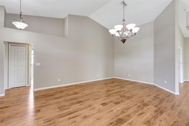 4539 Cabbage Key Ter, Bradenton, FL 34203 - spare room featuring high vaulted ceiling, light wood-style floors, and a chandelier