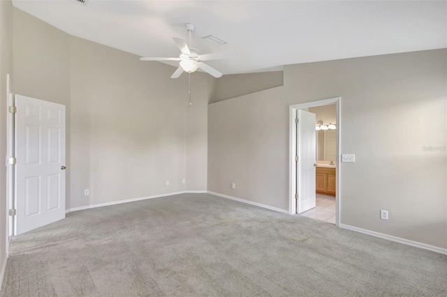 4539 Cabbage Key Ter, Bradenton, FL 34203 - unfurnished bedroom featuring light carpet, ensuite bathroom, vaulted ceiling, and a ceiling fan
