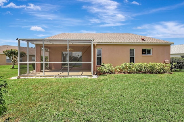 4539 Cabbage Key Ter, Bradenton, FL 34203 - rear view of property featuring stucco siding, a patio, a lawn, a lanai, and roof with shingles