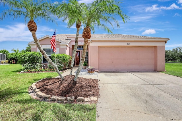 4539 Cabbage Key Ter, Bradenton, FL 34203 - single story home featuring driveway, stucco siding, a front yard, and an attached garage