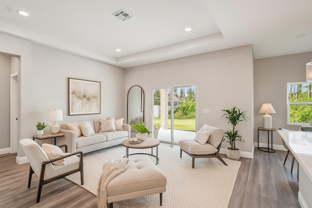 5534 Fairlane Dr, North Port, FL 34288 - living room with plenty of natural light, wood finished floors, recessed lighting, and a raised ceiling