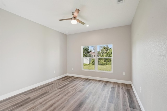 5534 Fairlane Dr, North Port, FL 34288 - spare room with wood finished floors, a ceiling fan, and recessed lighting
