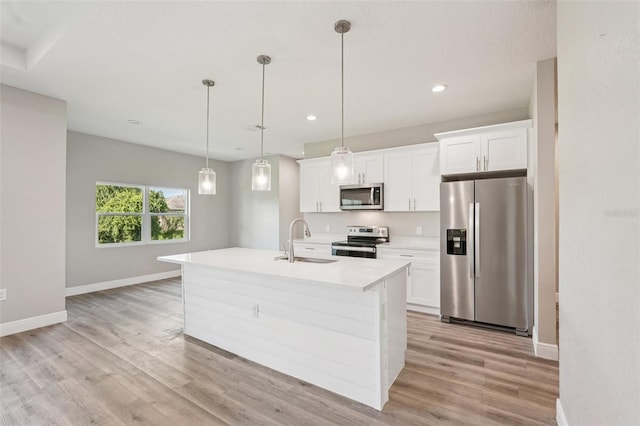 5534 Fairlane Dr, North Port, FL 34288 - kitchen with appliances with stainless steel finishes, light wood-style flooring, white cabinetry, light countertops, and recessed lighting