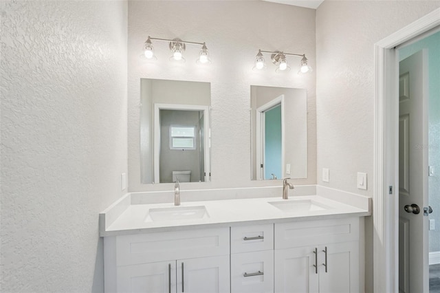 5534 Fairlane Dr, North Port, FL 34288 - bathroom featuring a textured wall and double vanity