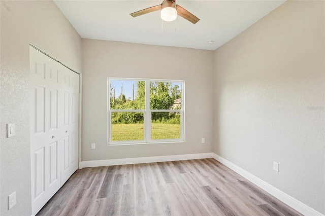 5534 Fairlane Dr, North Port, FL 34288 - unfurnished bedroom featuring light wood-style floors, a closet, and a ceiling fan