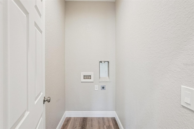 5534 Fairlane Dr, North Port, FL 34288 - washroom with hookup for an electric dryer, wood finished floors, hookup for a washing machine, and a textured wall