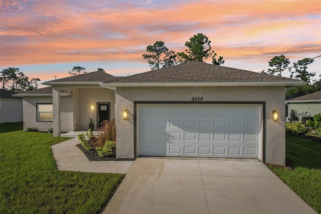 5534 Fairlane Dr, North Port, FL 34288 - ranch-style home featuring roof with shingles, stucco siding, concrete driveway, a lawn, and a garage
