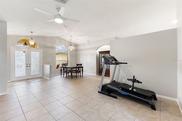 6118 56th Ter E, Bradenton, FL 34203 - workout room featuring french doors, arched walkways, vaulted ceiling, light tile patterned floors, and a ceiling fan