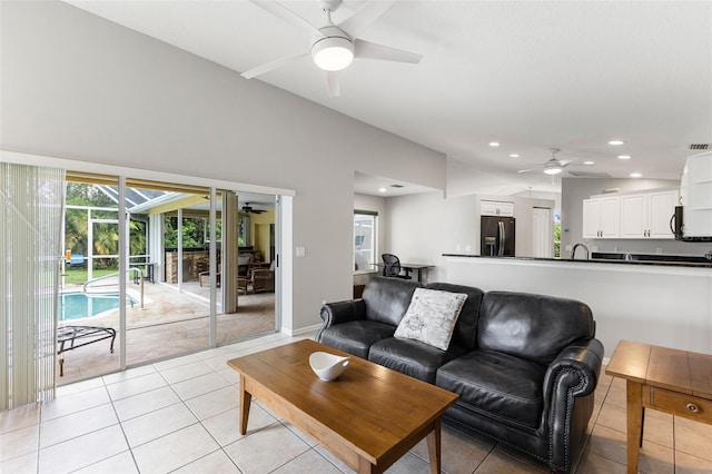 6118 56th Ter E, Bradenton, FL 34203 - living area featuring a ceiling fan, plenty of natural light, light tile patterned floors, recessed lighting, and a sunroom