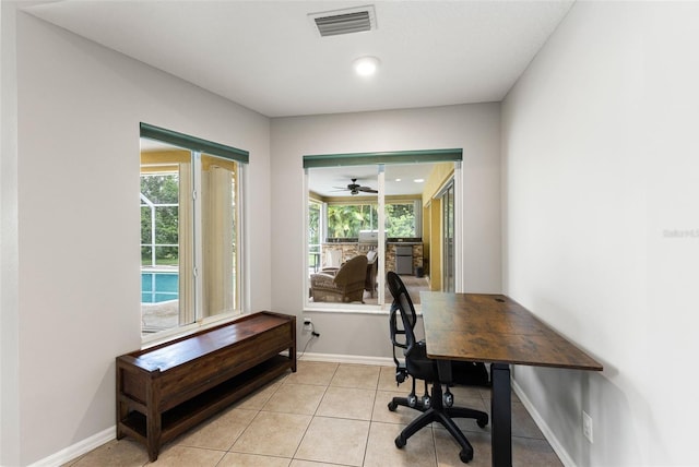 6118 56th Ter E, Bradenton, FL 34203 - home office with plenty of natural light, light tile patterned floors, and a ceiling fan