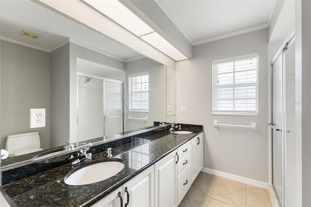 6118 56th Ter E, Bradenton, FL 34203 - full bathroom with double vanity, a stall shower, crown molding, and tile patterned floors
