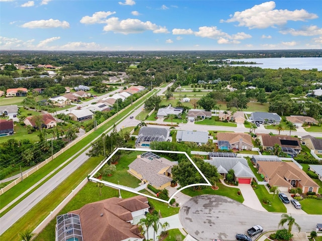 6118 56th Ter E, Bradenton, FL 34203 - aerial perspective of suburban area featuring property parcel outlined and a nearby body of water