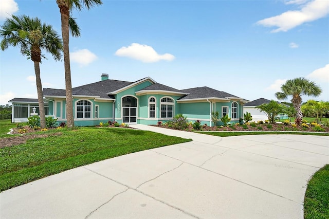 2555 Pear St, Port Charlotte, FL 33948 - ranch-style home featuring a front lawn, stucco siding, and a chimney