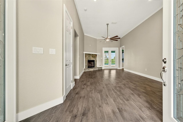 2555 Pear St, Port Charlotte, FL 33948 - unfurnished living room featuring dark wood-style floors, crown molding, a fireplace, and ceiling fan