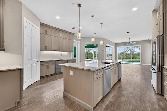 2555 Pear St, Port Charlotte, FL 33948 - kitchen featuring hardwood / wood-style floors, appliances with stainless steel finishes, a kitchen island with sink, ceiling fan, and recessed lighting