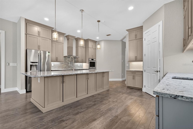 2555 Pear St, Port Charlotte, FL 33948 - kitchen with stainless steel appliances, tasteful backsplash, dark wood-type flooring, a center island with sink, and recessed lighting