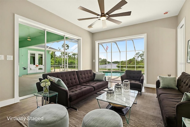 2555 Pear St, Port Charlotte, FL 33948 - living area featuring ceiling fan, wood finished floors, and a water view