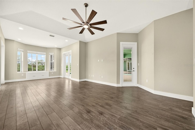 2555 Pear St, Port Charlotte, FL 33948 - unfurnished living room with dark wood-style flooring, a ceiling fan, and recessed lighting
