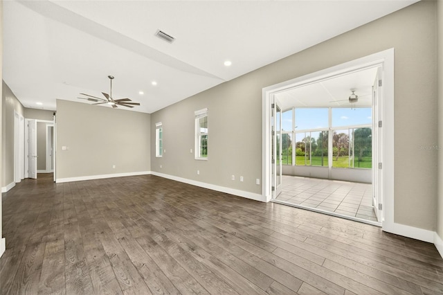 2555 Pear St, Port Charlotte, FL 33948 - unfurnished living room featuring a ceiling fan, dark wood-style flooring, healthy amount of natural light, and recessed lighting