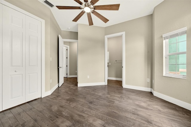 2555 Pear St, Port Charlotte, FL 33948 - unfurnished bedroom featuring dark wood-type flooring and ceiling fan