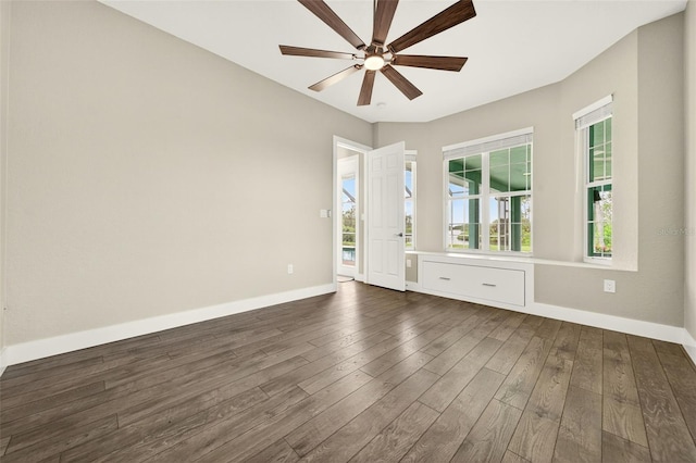 2555 Pear St, Port Charlotte, FL 33948 - empty room with dark wood-type flooring and a ceiling fan