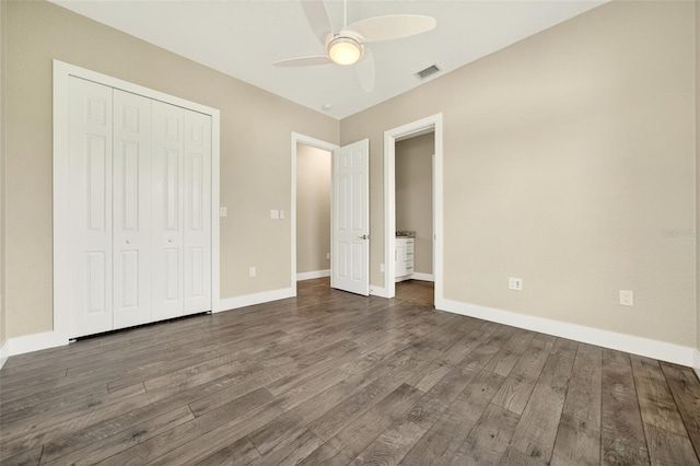 2555 Pear St, Port Charlotte, FL 33948 - unfurnished bedroom featuring dark wood finished floors, a closet, and ceiling fan