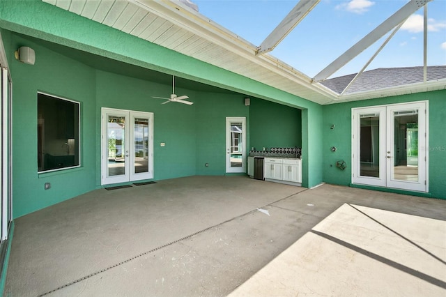 2555 Pear St, Port Charlotte, FL 33948 - back of property featuring french doors, a patio area, a ceiling fan, and stucco siding