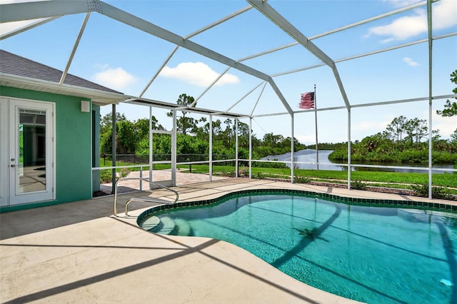 2555 Pear St, Port Charlotte, FL 33948 - outdoor pool featuring a water view, a patio, and glass enclosure