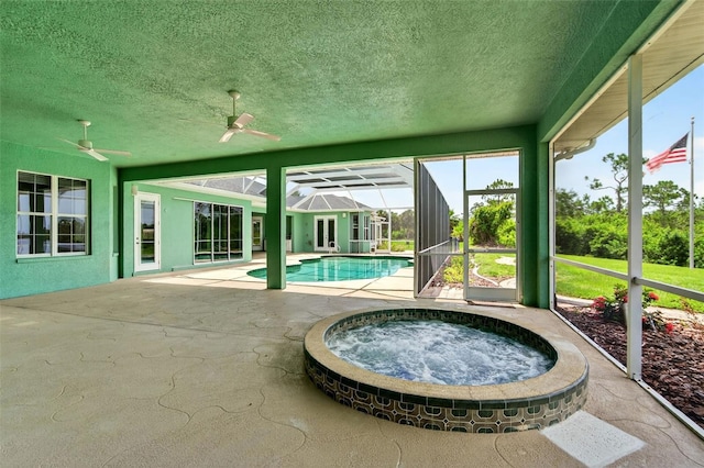 2555 Pear St, Port Charlotte, FL 33948 - swimming pool featuring an outdoor hot tub, a patio area, ceiling fan, and glass enclosure