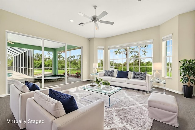 2555 Pear St, Port Charlotte, FL 33948 - carpeted living area featuring baseboards and ceiling fan
