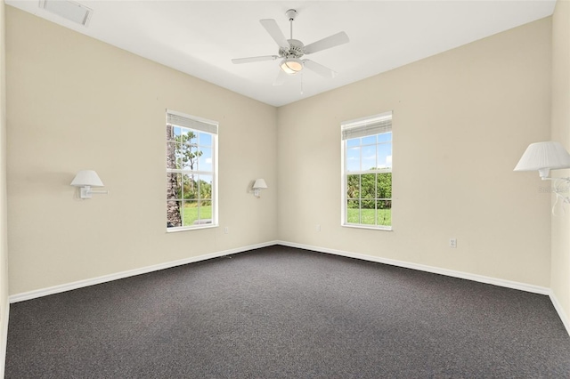 2555 Pear St, Port Charlotte, FL 33948 - spare room featuring a ceiling fan and dark carpet
