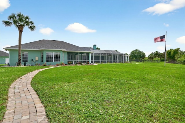 2555 Pear St, Port Charlotte, FL 33948 - back of house with a yard and a shingled roof
