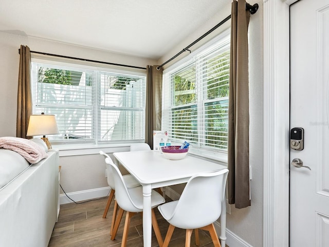 544 Canal Rd, Sarasota, FL 34242 - dining space featuring baseboards and light wood-style flooring
