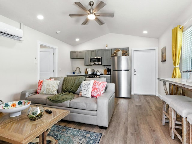 544 Canal Rd, Sarasota, FL 34242 - living area with a wall mounted AC, vaulted ceiling, ceiling fan, light wood-style floors, and recessed lighting