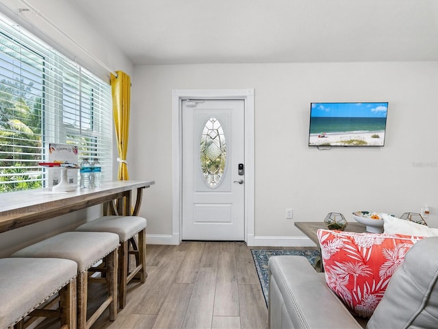 544 Canal Rd, Sarasota, FL 34242 - foyer entrance featuring healthy amount of natural light and light wood finished floors
