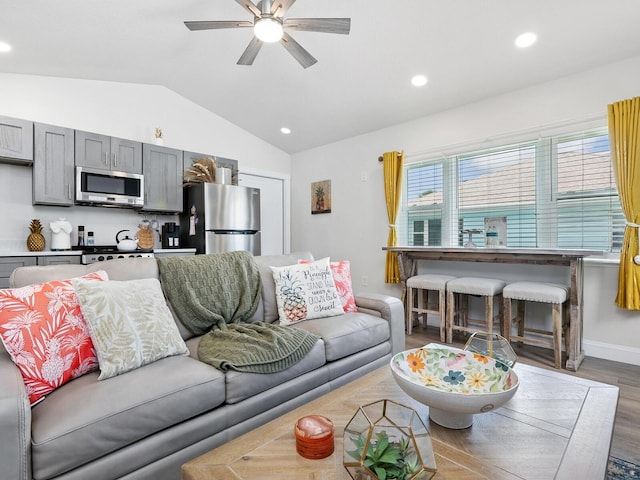 544 Canal Rd, Sarasota, FL 34242 - living area featuring vaulted ceiling, a ceiling fan, wood finished floors, and recessed lighting
