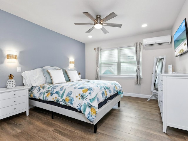 544 Canal Rd, Sarasota, FL 34242 - bedroom with a wall unit AC, wood finished floors, recessed lighting, and ceiling fan