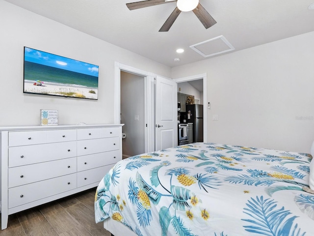 544 Canal Rd, Sarasota, FL 34242 - bedroom with freestanding refrigerator, dark wood-style flooring, attic access, a ceiling fan, and recessed lighting