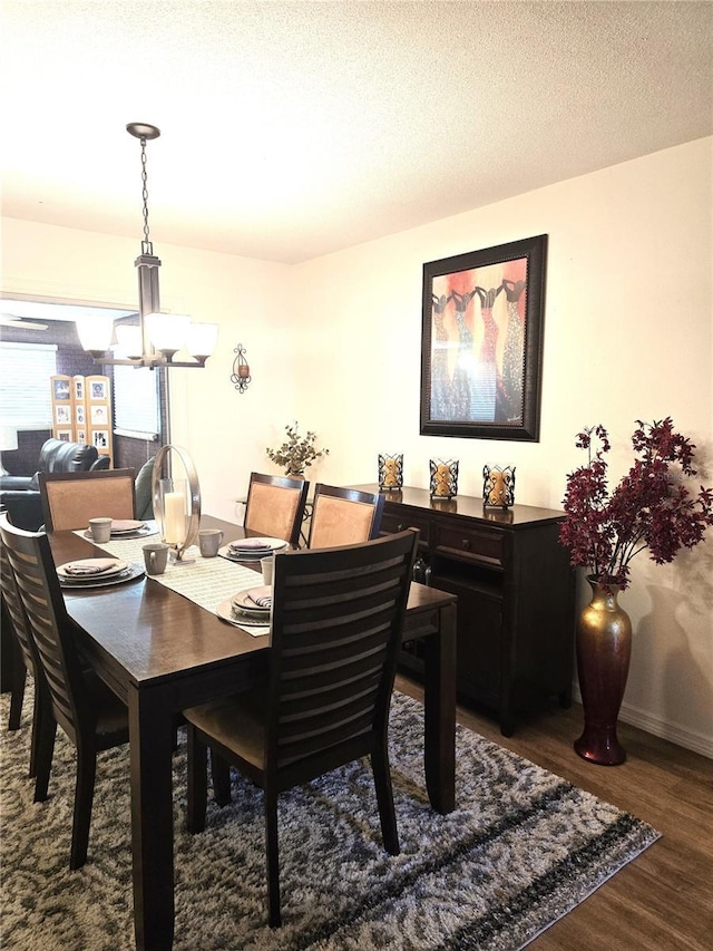 1903 4th Ave W, Palmetto, FL 34221 - dining area featuring a chandelier and wood finished floors