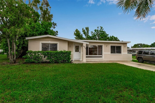 6439 Lafayette Rd, Bradenton, FL 34207 - ranch-style house featuring stucco siding and a front lawn