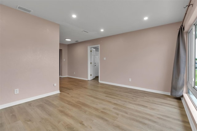 6439 Lafayette Rd, Bradenton, FL 34207 - empty room featuring light wood-style floors, recessed lighting, and healthy amount of natural light